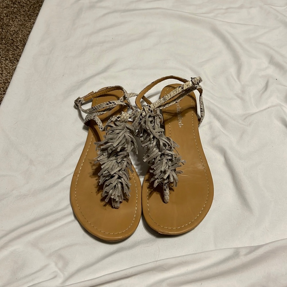 City classified sandal with fringe detail and ankle strap closure